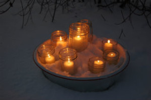 candles in snow- easy outdoor lighting